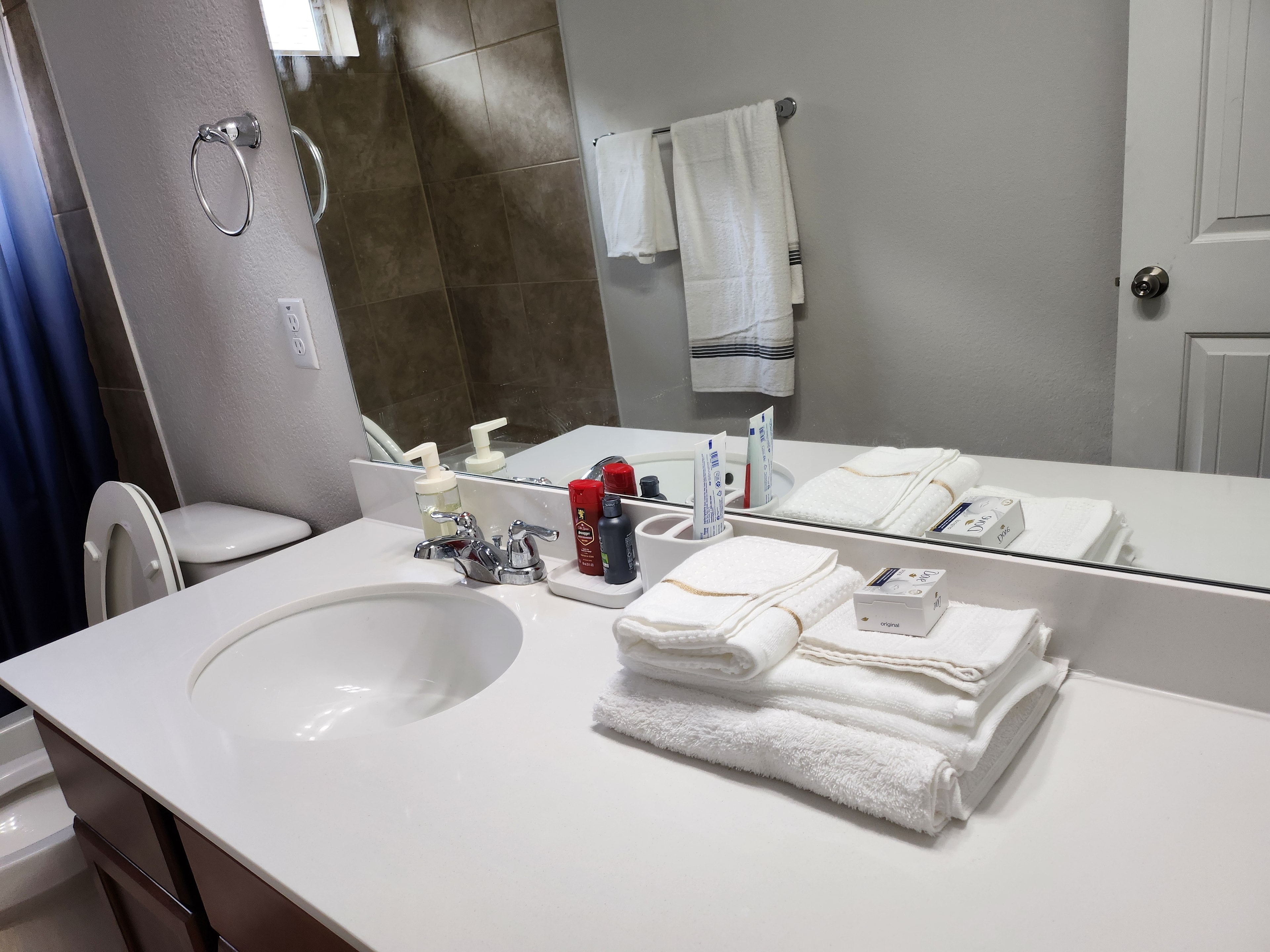 Bathroom with towels and amenities
