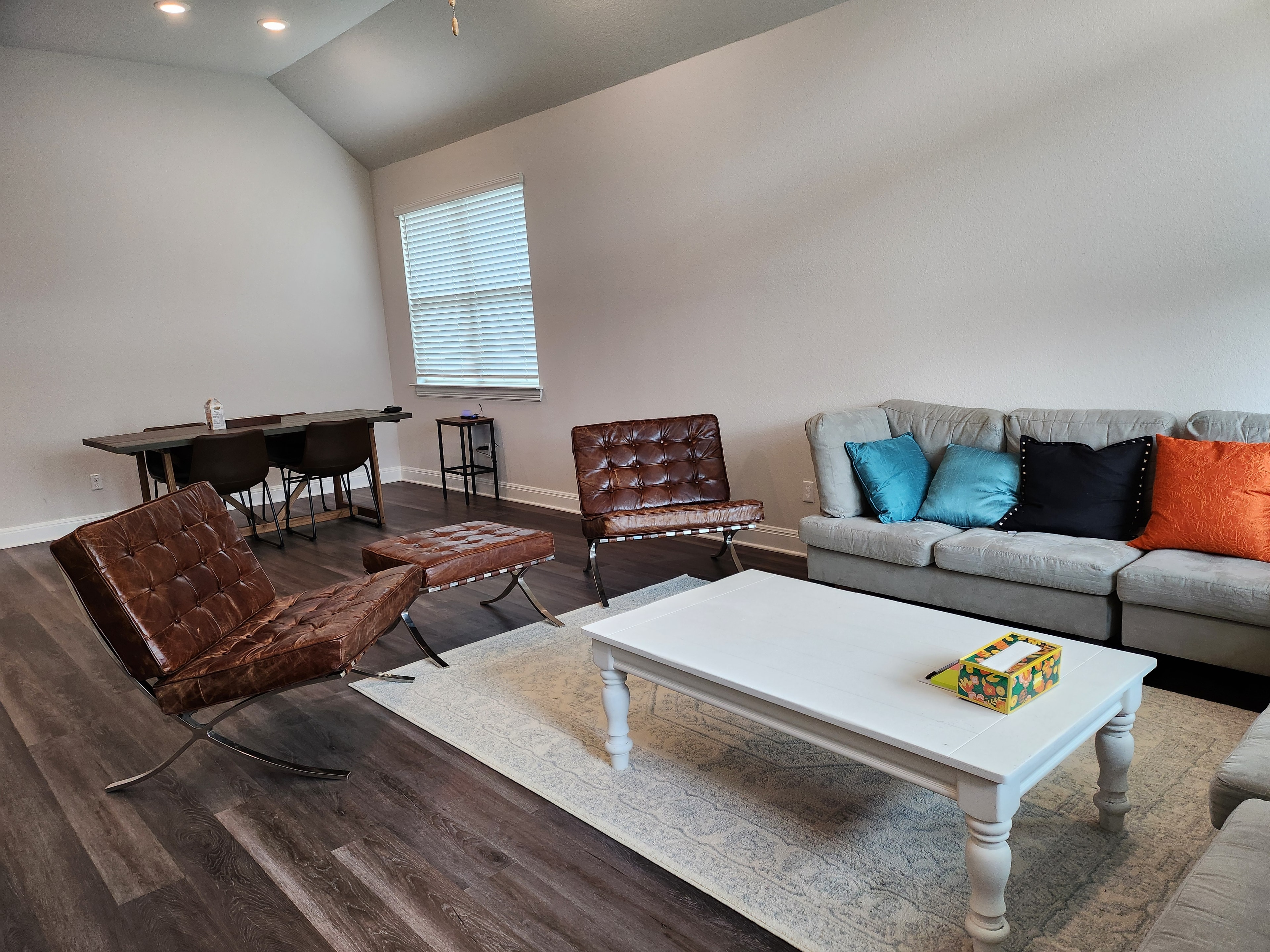 Living room with leather chairs and sofa