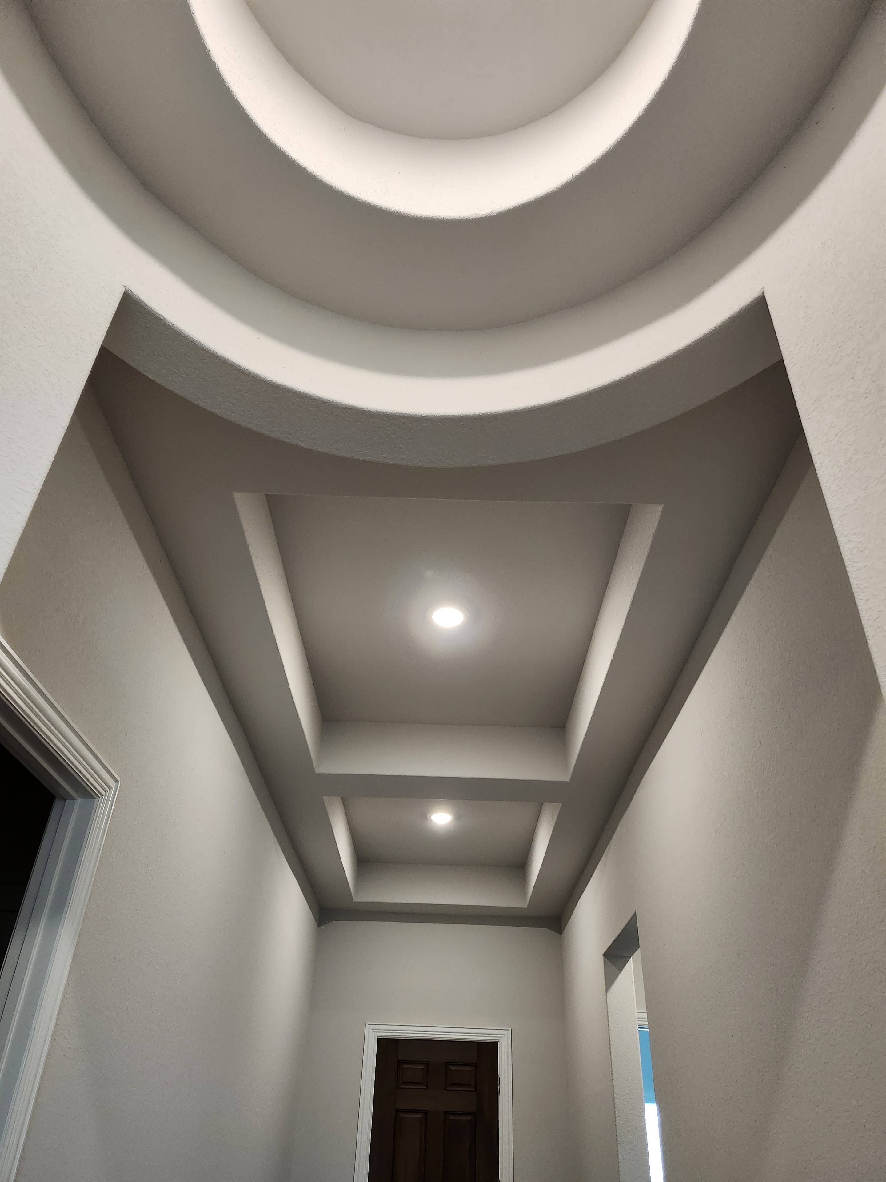 Architectural hallway with geometric ceiling