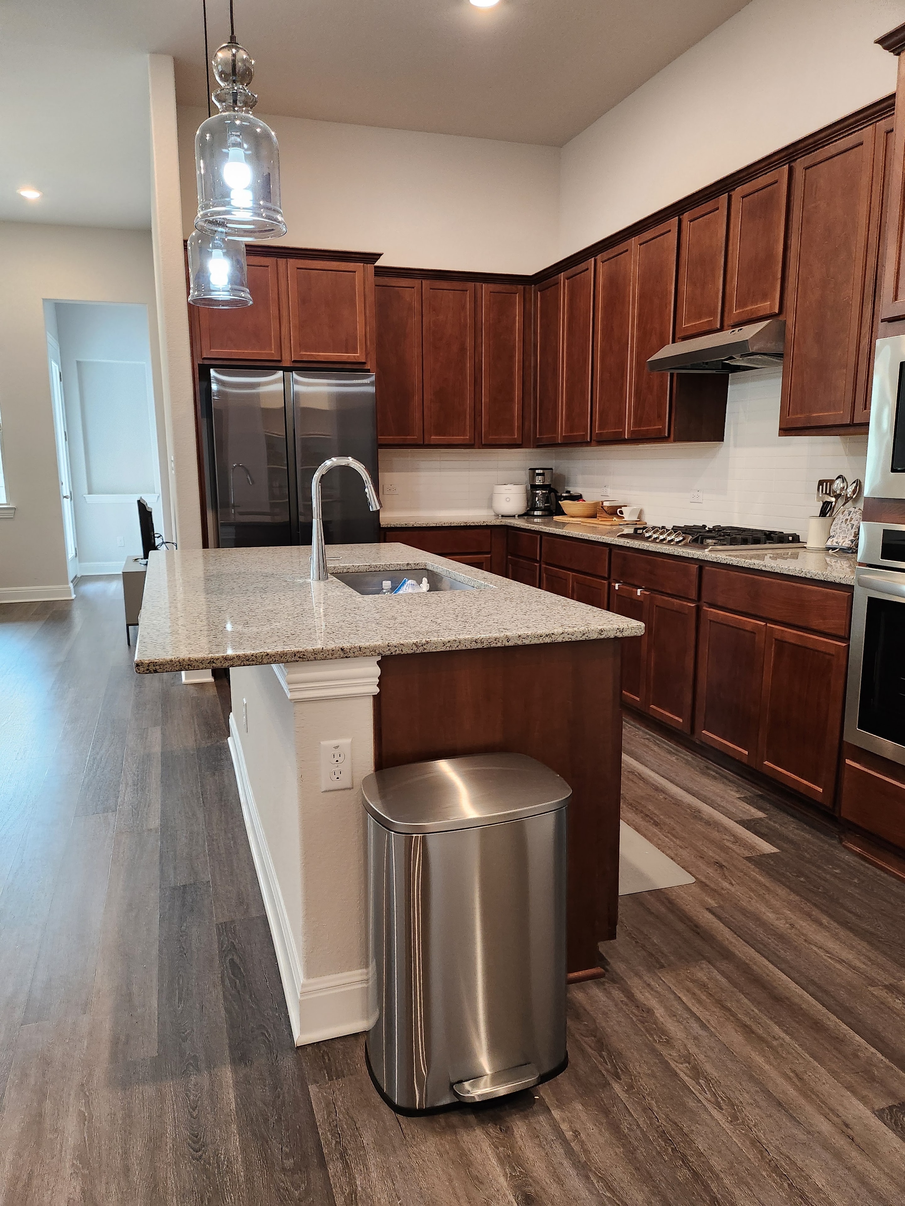 Kitchen with island and pendant lights
